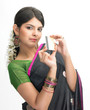 Woman in sari holding credit  card