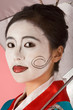 Geisha Japanese woman with umbrella and facepaint Geisha Japanese woman with umbrella and facepaint