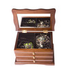 open wooden box from drawers on jewellery