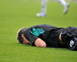 Young soccer man lying on the grass Young soccer man lying on the grass