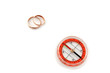 isolated compass with golden wedding rings