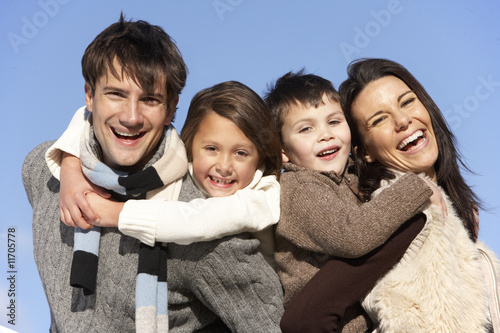 Parents Piggy Backing Their Children