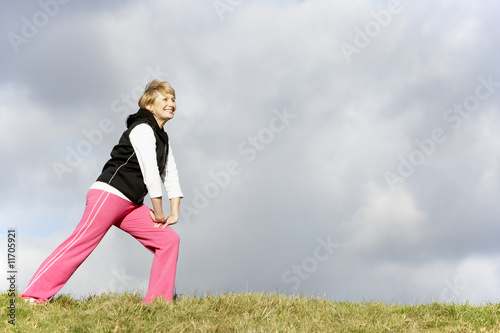 Photo: Senior Woman Stretching In Park Senior Woman Stretching In Park