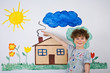 Young boy painting on wall