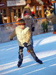 child learning ice skating