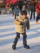 child learning ice skating
