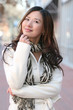 Winter Theme - Beautiful Asian Girl in White Coat and Scarf Smil
