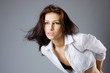 Studio portrait o fa beautiful brunette in motion