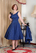 attractive retro woman in fifties dress & hat