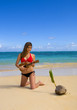 young woman in a bikini at a tropical beach in Hawaii