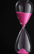 close up of the hour glass on black