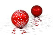 Two red glass christmas baubles with silver stars