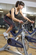 Photo: working out in the gym on a bike working out in the gym on a bike