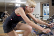 working out in the gym on a bike