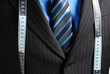 Business man with tape measure Business man with tape measure