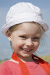Smiling little girl on the sea coast
