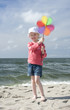 Cheerful little girl with pinwheel II