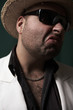 Photo: unhappy man with straw hat and sun glasses unhappy man with straw hat and sun glasses