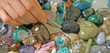 Crystal Therapist choosing stones close up