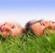 A couple enjoying lying on grass
