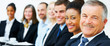 Smiling business people seated in a row