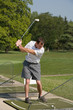 Man Practicing Golf Man Practicing Golf