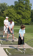 Family Practicing Golf Family Practicing Golf