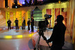 Cameraman works in the studio - recording show in TV studio