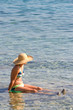 Woman sitting in the water.