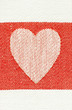 Red heart on a table cloth