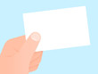 Hand holding a blank white (business) card