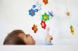 Baby playing in a crib