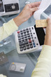 Woman Adding up Credit Card Charges