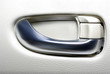 Aluminium door handle of modern japanese car. Abstract backgroun