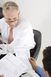 Businessmen Working in Office
