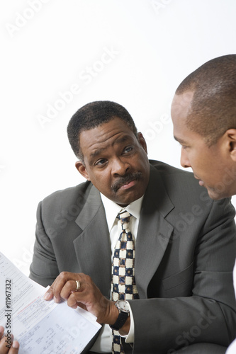 Photo: Accountant and Client Going over Bills Accountant and Client Going over Bills