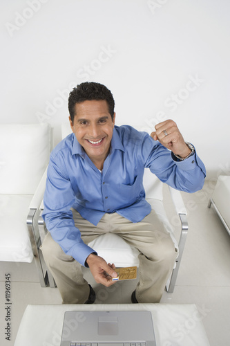 Photo: Man Holding Credit Card Man Holding Credit Card