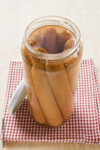 Photo: frankfurters in an opened jar frankfurters in an opened jar