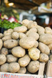 potatoes in a crate at a market
