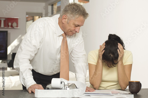 Photo: Tax Accountant Giving Woman Bad News Tax Accountant Giving Woman Bad News