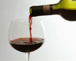 pouring chianti classico into a red wine glass