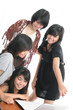 happy students look at laptop