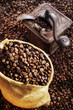 coffee beans in sack and in old coffee mill
