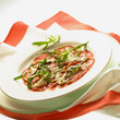 carpaccio with rocket, pine nuts and parmesan