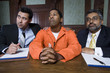 Lawyers with criminal in court