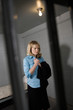 Female criminal behind bars in jail
