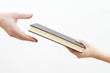 hands holding book