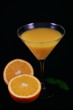 Orange juice in a glass and orange on black background_top