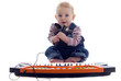 Baby sings and plays keyboard