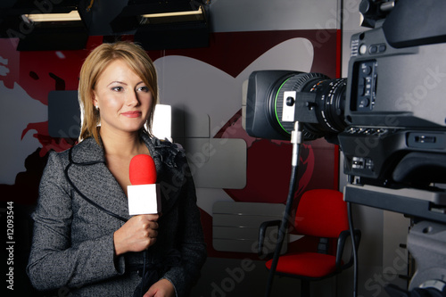 Photo: live television transmission and smiling reporter live television transmission and smiling reporter